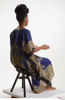 Dina Moses  1 dressed sitting traditional decora long african…